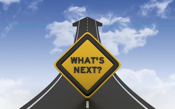 What's Next? sign leadingto clouds