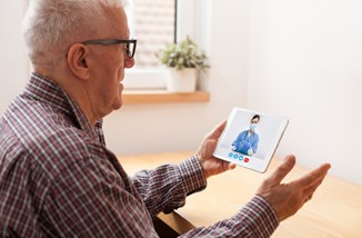 Old Man Using Tablet For Video Call Istock 1308505733 Plyushkin