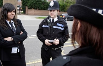 Police officers with schoolgirl