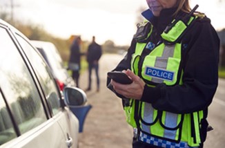 Police Woman With Phone GOV.UK OGL