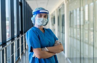 Nurse In PPE Istock 1283141343 Alfexe
